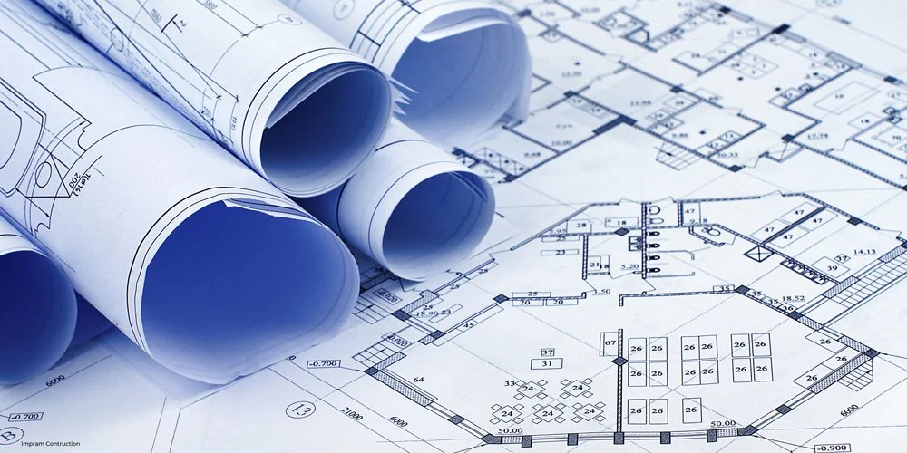 Rolled architectural plans on construction drawings